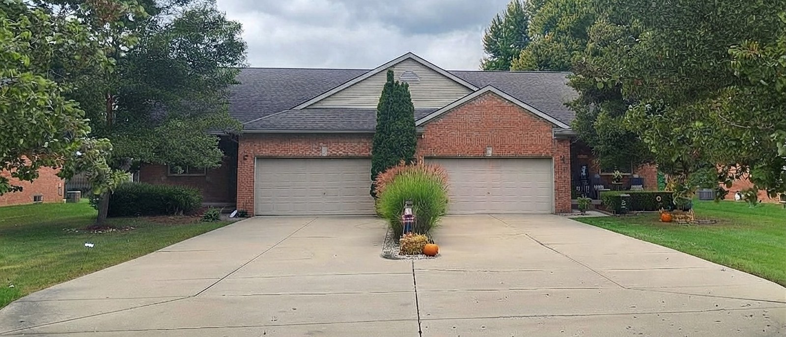 Brick duplex with attached two-car garages
