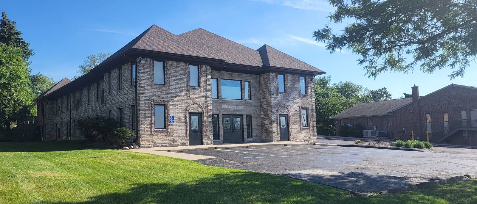 Two-storey brick and stone office building at 2490 Walton Boulevard, Rochester Hills