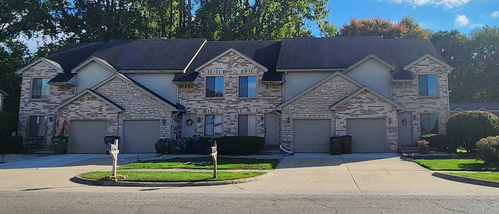 Brick and stone townhomes with attached garages